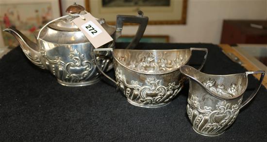 Late Victorian embossed silver three piece tea set